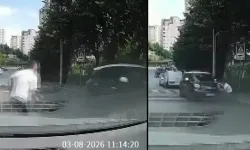 Yokuştan kayan aracı kaputundan tutarak durdurdu!