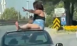 Kaputun üstüne çıkan kadın ve sürücüye gözaltı